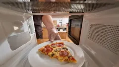 What does a microwave oven actually do to food?